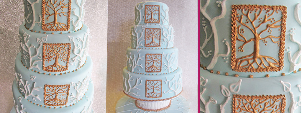 Light blue cake piped with the imagery of the four seasons