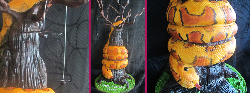 Sculpted tree cake with orange snake wrapped around
