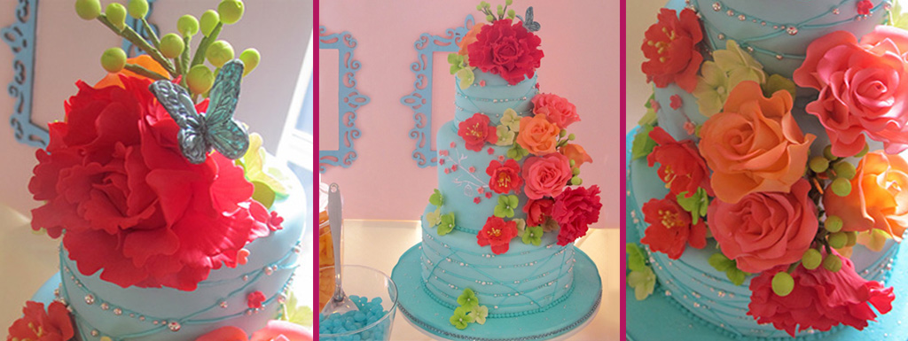 Coral flowers with aqua fondant covered cake